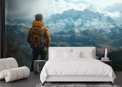 A teenager enjoying a solo hiking adventure in a scenic mountain range, capturing photos of breathtaking landscapes. Concept of solo travel and nature exploration. Wall mural