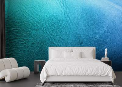 Blue fabric texture. Background of blue fabric with seam and holes. Wall mural