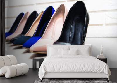 High heels footwear on a white background. Fashion concept, catwalk. Online store, fashion store, sale of shoes. The high heel lies next to the second one. Shoes for women. Wall mural