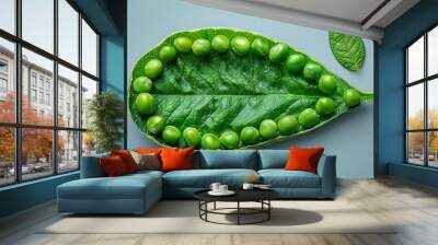 Peas arranged to create the outline of a leaf. Concept of green nutrition. Generative Ai. Wall mural