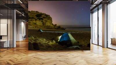 two tents on a beach at night with stars above and rock in background, Figueira, Portugal Wall mural