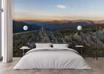 View from Serra da Arada over mountain landscape at evening sunset with sharp rocks in foreground, Sao Pedro do Sul, Portugal Wall mural