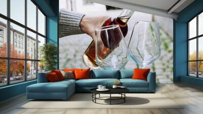 Man with glasses of rose wine Wall mural