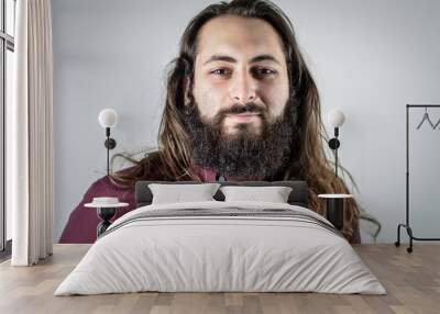 portrait of a young middle eastern businessman with beard and long hair Wall mural