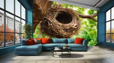 Image of a beautiful bird's nest perched high in a tree. This serene scene captures the peace and natural beauty of bird life. Generative AI Wall mural