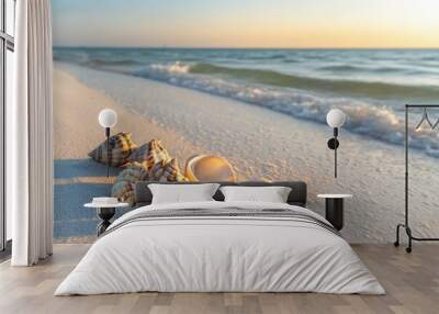 Seashells scattered on a serene beach at sunset. Wall mural