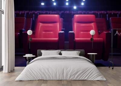 Two red cinema seats in an empty theater with bright lights. Wall mural