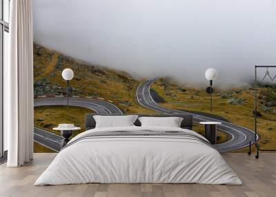 the Transfagarasan road from the Fagaras mountains in the fog Wall mural