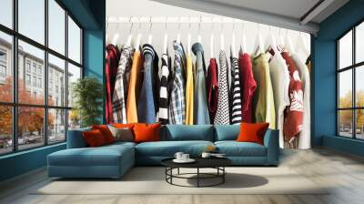 Collection of clothes hanging on rack Wall mural