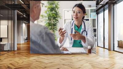 Doctor and patient are discussing at clinic Wall mural