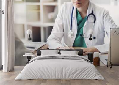 Doctor giving prescription to patient Wall mural