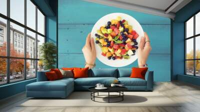 Mixed summer fruits salad top view Wall mural