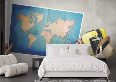 Woman holding world map travel concept Wall mural