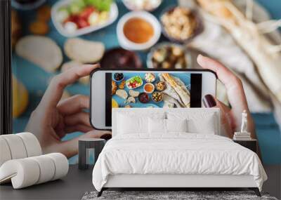 Woman taking a photo of breakfast table Wall mural