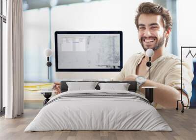 young man working on computer Wall mural