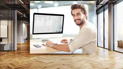 young man working on computer Wall mural