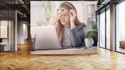 Young tired working woman at work Wall mural