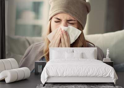 Young woman suffering from cold Wall mural