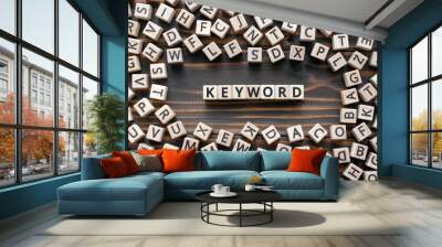 Keyword - word from wooden blocks with letters, search information that contains that word keyword concept, random letters around, top view on wooden background Wall mural