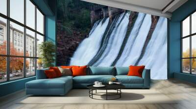 Water flowing down the walls of the old small hydropower plants Wall mural