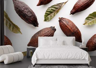 Cocoa pods with cocoa leaves on a white background, creative flat lay food concept Wall mural