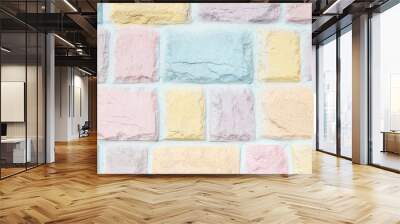 Colorful pastel brick wall texture background. Pink, yellow, orange purple and blue. Wall mural