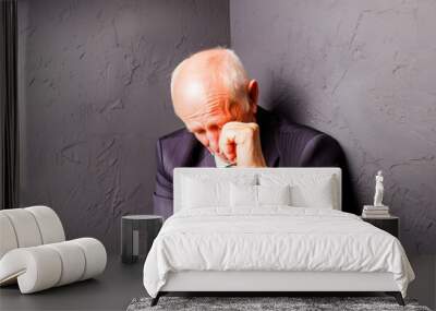 crying old man in a black room wearing a suit Wall mural