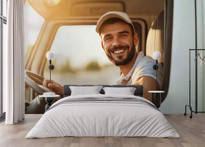 A smiling delivery driver in his truck. Wall mural