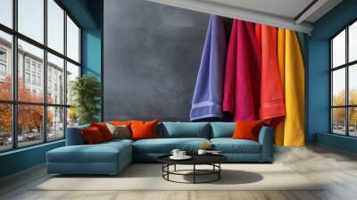 Vibrant Towels in Rich Hues Folded Neatly on a Display Rack Wall mural