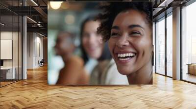 Image of a diverse team of call center employees laughing and smiling during a training session, promoting a positive work culture Wall mural