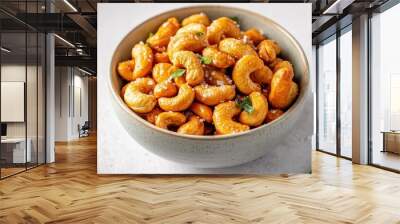 Overhead shot of a bowl filled with homemade roasted salted cashews, golden brown cashews glistening with salt, inviting and delicious Wall mural