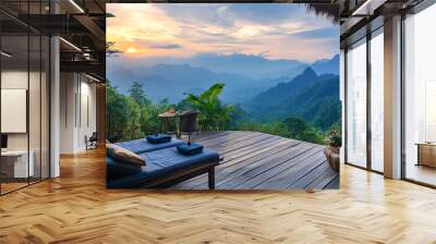 A tranquil mountain setting in Thailand, where a massage session is taking place on a wooden deck with a stunning view Wall mural