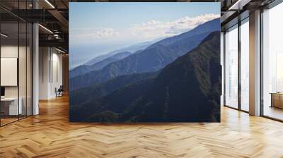 View of the Mountain Chain of El Avila in Venezuela, blue sky and caribbean sea in the background Wall mural