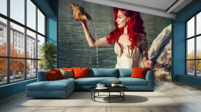 Cosplay on a  popular  mermaid , woman with red hair Wall mural