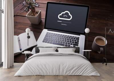 Cloud upload processing data on laptop with internet with office equipment and wooden desk background Wall mural