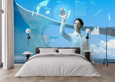 Attractive brunette with interface in futuristic interior Wall mural