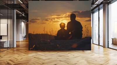 A father and son watching the sunset together, sharing a moment of tranquility and bonding amidst the beauty of nature. Wall mural