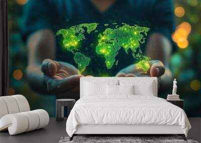 A glowing world map in the hands of a businessman. Wall mural