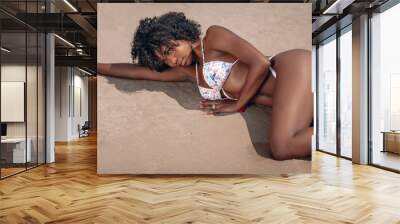  image of beautiful young afro american woman in colorful swimwear lying on the sand on the beach Phuket. Thailand. Photo of Bayleigh Dayton - Miss Missouri 2017 Wall mural