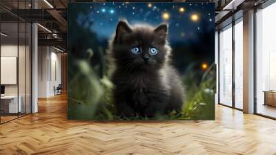 cute black kitten with big blue eyes in the grass Wall mural