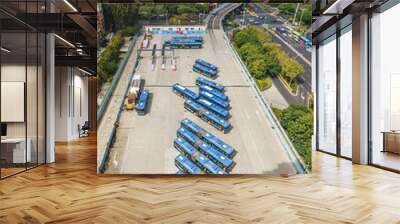 Aerial view of Xiamen BRT (Bus Rapid Transit) station with public buses and the viaducts over city skyline Wall mural