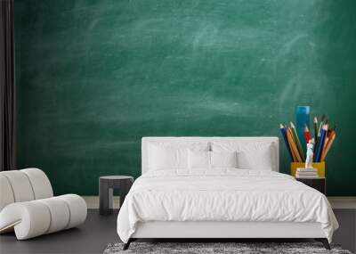 Education and reading concept - group of colorful books on the wooden table in the classroom, blackboard background Wall mural