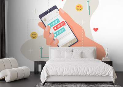 Application, smartphone in hand, online communication, chat with likes and emoticon smileys isolated. Vector phone or cellphone with dialogue on screen display, person holding gadget with sms messages Wall mural