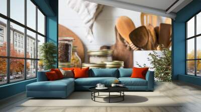 Various cereals and seeds - peas, beans, rice, pasta, flax, lentils in glass jars on the table in the kitchen Wall mural