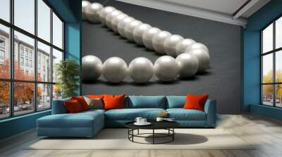 String of pearls on dark background Wall mural