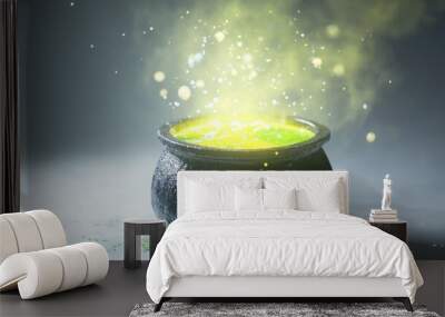 A cauldron of bubbling green potion with magical sparks. Wall mural