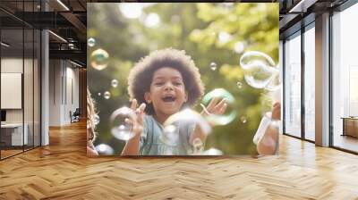 happy multi ethnic group of little friends playing with soap bubbles Wall mural