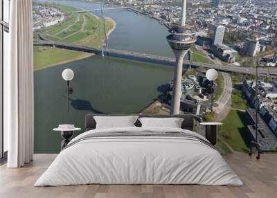 Aerial view over Dusseldorf, tv tower, Rheinknie bridge, buildings and metropolis. Wall mural