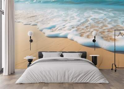 Soft waves with foam blue ocean sea on a golden sunny sandy beach in resort on summer vacation rest. The symbol of the sun drawing on the sand. Background close up Wall mural