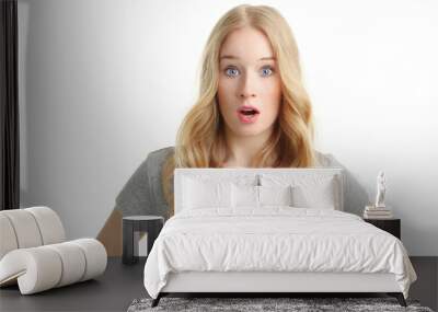 Close-up of a young woman looking excited against white backgrou Wall mural